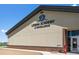 Leman Academy of Excellence building with sign, brick accents, and manicured landscape under a beautiful blue sky at 5861 Tesoro Pt, Parker, CO 80134