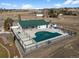 An aerial view of the community pool and recreation center, providing leisure and fitness opportunities at 5861 Tesoro Pt, Parker, CO 80134
