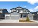 Beautiful two story home with three car garage, stone accents, and manicured lawn in a quiet neighborhood at 5861 Tesoro Pt, Parker, CO 80134