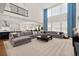 Spacious living room with high ceilings, large windows, and a comfortable sectional sofa at 5861 Tesoro Pt, Parker, CO 80134