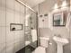 Modern bathroom with glass shower, sleek fixtures, and neutral tile work at 5435 W 97Th Pl, Broomfield, CO 80020