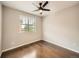 Clean bedroom with a ceiling fan, a window and hardwood floors at 5435 W 97Th Pl, Broomfield, CO 80020
