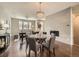 The living room has hardwood floors, a tiled fireplace, and a large window for natural light at 5435 W 97Th Pl, Broomfield, CO 80020