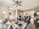 Spacious living room with fireplace, hardwood floors, ceiling fan, and modern furnishings at 5435 W 97Th Pl, Broomfield, CO 80020