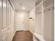 Well-organized mud room with hooks and storage shelves at 5435 W 97Th Pl, Broomfield, CO 80020