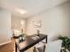 Well-lit office area featuring a modern desk, soft rug, and neutral tones for a calming workspace at 5435 W 97Th Pl, Broomfield, CO 80020