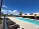 Enjoy the sun and a refreshing swim in the community's sparkling pool on a clear day at 5435 W 97Th Pl, Broomfield, CO 80020