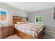 Bedroom featuring a spacious bed, a nightstand, and a window, creating a cozy atmosphere at 2967 Olive St, Denver, CO 80207