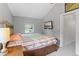 Bedroom featuring a spacious bed, a nightstand, and a window, creating a cozy atmosphere at 2967 Olive St, Denver, CO 80207