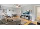 Comfortable living room featuring hardwood floors, ample seating, and neutral tones at 2967 Olive St, Denver, CO 80207
