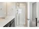 Bathroom showcasing a glass-enclosed shower and modern fixtures at 6988 Ipswich Ct, Castle Pines, CO 80108