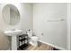 Bathroom with a pedestal sink, toilet, and a glass-enclosed shower at 6988 Ipswich Ct, Castle Pines, CO 80108