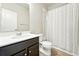 Well-maintained bathroom features a shower-tub combo, a toilet, and a sink with modern vanity at 6988 Ipswich Ct, Castle Pines, CO 80108