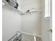 Walk-in closet with shelving and a shoe rack, providing ample storage space at 6988 Ipswich Ct, Castle Pines, CO 80108