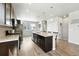 Spacious kitchen features an island with granite countertops and modern appliances at 6988 Ipswich Ct, Castle Pines, CO 80108
