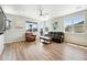 Bright living room featuring hardwood floors, neutral walls, and lots of natural light at 6988 Ipswich Ct, Castle Pines, CO 80108