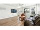 Cozy living room featuring a large window, hardwood floors, and recessed lighting at 6988 Ipswich Ct, Castle Pines, CO 80108