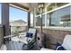 Cozy patio features comfortable seating and a heater for year-round enjoyment at 6988 Ipswich Ct, Castle Pines, CO 80108