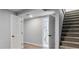 Finished basement area with stairs and access to a bathroom at 1705 S Yuma St, Denver, CO 80223