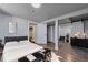 Spacious basement bedroom with modern decor, wood floors, and ample closet space at 1705 S Yuma St, Denver, CO 80223