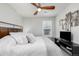 Bright bedroom featuring a ceiling fan, windows, and decor at 8358 Howell St # B, Arvada, CO 80005