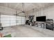Spacious two car garage featuring concrete floors and drywall with exposed joists at 8358 Howell St # B, Arvada, CO 80005