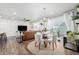 Open concept living area featuring modern furnishings, wood floors, and plenty of natural light at 8358 Howell St # B, Arvada, CO 80005