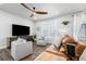 Comfortable living room with plush seating, wood-look floors, and stylish accents at 8358 Howell St # B, Arvada, CO 80005