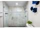 Sleek bathroom showcases glass enclosed shower with marbled tile at 32399 Woodland Dr, Evergreen, CO 80439