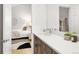 Modern bathroom with a vanity and undermount sink leading to bedroom at 32399 Woodland Dr, Evergreen, CO 80439