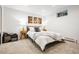 Neutral bedroom with matching bedside tables and decor at 32399 Woodland Dr, Evergreen, CO 80439