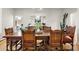 Formal dining room boasts hardwood floors, antique furniture, and modern decor at 32399 Woodland Dr, Evergreen, CO 80439