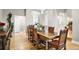 Elegant dining room featuring a hardwood floor and an antique-style wooden table with six chairs at 32399 Woodland Dr, Evergreen, CO 80439