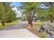 Long driveway leads to this well maintained estate with mature trees at 32399 Woodland Dr, Evergreen, CO 80439