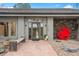 Charming front entrance with modern decor and stone accents on this lovely home at 32399 Woodland Dr, Evergreen, CO 80439