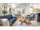Spacious living room featuring hardwood floors, modern decor, stone accents and plenty of natural light at 32399 Woodland Dr, Evergreen, CO 80439