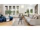 Bright, modern living room featuring hardwood floors, comfortable seating, and plenty of natural light at 32399 Woodland Dr, Evergreen, CO 80439