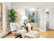 Relaxing reading nook with accent chair, modern art, and ample natural light at 32399 Woodland Dr, Evergreen, CO 80439