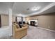 Finished basement featuring a cozy fireplace, plush carpeting, and neutral paint colors at 6011 Welch St, Arvada, CO 80004