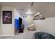 Basement features a media center with mounted TV, seating, and pop art at 6011 Welch St, Arvada, CO 80004