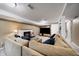 Finished basement featuring a cozy fireplace and a large sectional sofa, perfect for relaxation at 6011 Welch St, Arvada, CO 80004