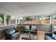 Relaxing sunroom featuring wicker furniture and ample windows to let in natural light at 6011 Welch St, Arvada, CO 80004