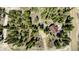 An aerial view of a charming cabin nestled amongst lush trees with a durable brown roof at 29 Gregory Cir, Breckenridge, CO 80424