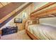 Bedroom with a wooden bunk bed, TV, and wood-paneled walls for a rustic feel at 29 Gregory Cir, Breckenridge, CO 80424