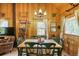 Cozy dining room with rustic decor and wood paneled walls and floors at 29 Gregory Cir, Breckenridge, CO 80424