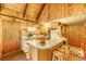 Eat-in kitchen with wood paneling and updated appliances at 29 Gregory Cir, Breckenridge, CO 80424