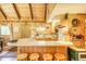 Eat-in kitchen featuring wood paneling, a breakfast bar and plenty of counter space at 29 Gregory Cir, Breckenridge, CO 80424