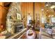 Living room featuring a stone fireplace, wood accents, and an open floor plan at 29 Gregory Cir, Breckenridge, CO 80424