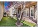 Beautiful backyard featuring artificial grass, patio, and lush landscaping at 2616 E Cherry Creek South Dr, Denver, CO 80209