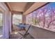Cozy balcony featuring a hammock and views of a blooming tree at 2616 E Cherry Creek South Dr, Denver, CO 80209